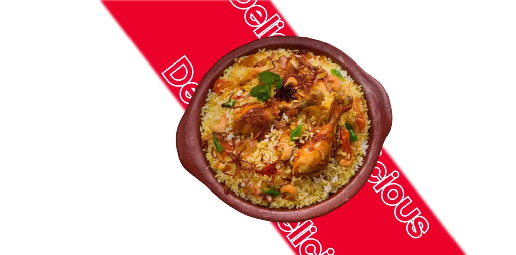 Chicken biryani served in a clay pot with a "delicious" tag.