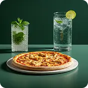 "Chicken pizza served on a white plate with mojito and lime soda at Kyra Food Street Chennai"